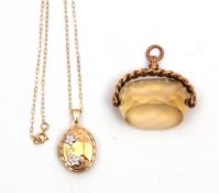 Mixed Lot: citrine swivel fob in a 9ct gold plaited frame, together with a modern 9ct gold locket