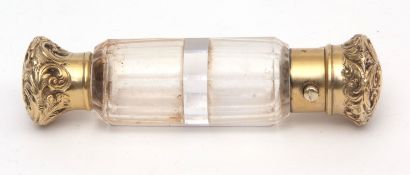 Late 19th century gilt metal and clear cut glass double ended scent bottle, with hinged and gilt