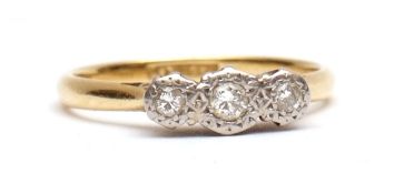 Precious metal three-stone diamond ring, the three small brilliant cut diamonds in illusion