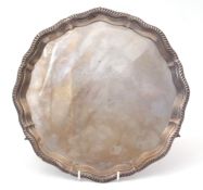 Elizabeth II presentation inscribed salver of shaped circular form with applied gadrooned border and