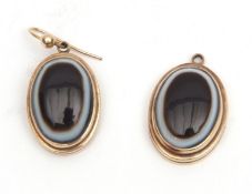 Pair of 9ct gold banded agate earrings, the oval shaped cabochon agates in plain polished frames,