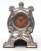 Edward VII silver mounted desk timepiece, the Art Nouveau type embossed mount to a black cloth