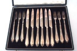 Cased set of six each dessert knives and forks of single piece construction, combined wt approx