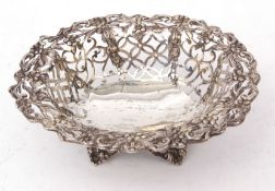 Late Victorian table basket of pierced oval form with foliate and floral detail on cast and