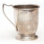 George VI christening mug of plain polished form with strap work handle on spreading foot, height