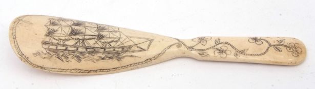 Carved bone shoe horn, the handle decorated with floral detail and a standing elephant and further