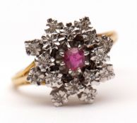 Modern precious metal ruby and diamond cluster ring, the central circular cut ruby claw set and