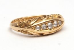 Early 20th century 18ct gold and five stone diamond ring, boat shaped and set with five small
