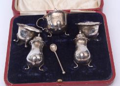 Edward VII five-piece cruet set comprising two open salts, two pepper casters and single lidded
