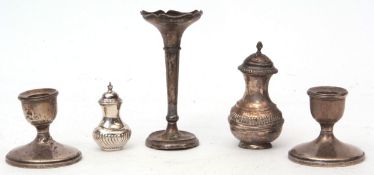 Mixed Lot: two various pepper casters, pair of squat candlesticks and single trumpet vase (