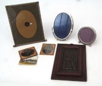 Mixed Lot: silver mounted oval photograph frame together with two further base metal examples, two