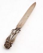 Australian silver paper knife with plain polished blade and cast handle modelled in the form of a