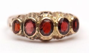 Antique 9ct stamped five stone garnet ring, of oval shape, graduated size, each individually bezel