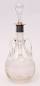 Edward VII silver mounted and clear glass decanter of baluster form with three applied loop