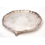 Mid-19th century electro-plated salver of shaped circular form with applied rim, foliate chased