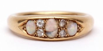 Mid-20th century 18ct gold opal and diamond ring, boat shaped having three graduated opals