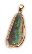 Mid-grade yellow metal and opal pendant, the stylised oval shaped opal 25 x 10mm, claw set in a