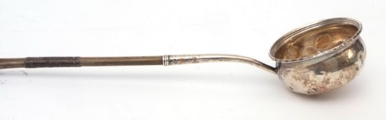 Early 19th century Coin silver and whalebone toddy ladle, the circular baluster bowl initialled