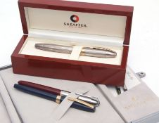 Mixed Lot: cased silver and gilt Schaeffer fountain pen, the engine turned body with pull off