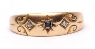 Antique 18ct gold sapphire and diamond ring, the small central sapphire in a star engraved setting