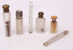 Mixed Lot: two various silver mounted and clear-cut glass toiletry and scent bottles together with