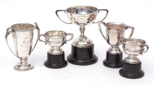 Mixed Lot: four various presentation inscribed trophy cups, weight 357gms, together with a further