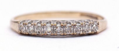 9ct gold and diamond ring, line set with nine small diamonds, size O/P