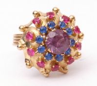 Modern yellow metal cluster ring, set with a synthetic alexandrite, sapphires and rubies, basket