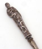 Victorian large button hook with long and tapering hook, fitted with silver handle depicting a woman