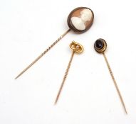 Mixed Lot: three antique stick pins, a yellow metal knot finial example stamped 18ct, an agate