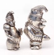Mixed Lot: two various cast white metal vesta cases, both depicting Mr Punch, with hinged and sprung
