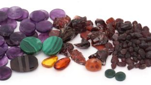 Mixed Lot: packet containing a collection of various, mainly rough cut, semi-precious stones