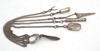 Late 19th century bright cut steel mounted five-strand chatelaine, the mount modelled in the form of