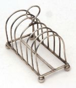 Edward VII six-slice toast rack of domed wire work construction with central carry handle and raised