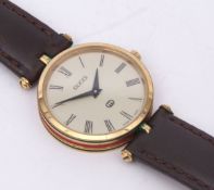Late 20th century gold plated dress watch, Gucci, the movement (unseen) to a signed cream dial