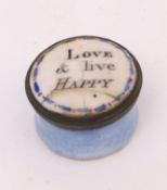 Early 19th century enamelled pill box of waisted circular form with pale blue body and snap-on cover