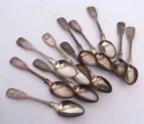 Eleven Victorian provincial Fiddle pattern tea spoons, initialled, length 14 1/2 cms, combined wt