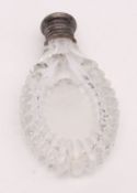 Mid-19th century clear cut glass perfume flask, the oval body with slice cut border to a hinged