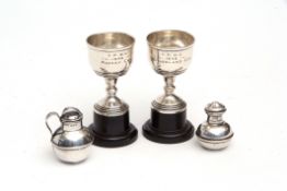 Mixed Lot: two various presentation engraved small trophy cups together with a novelty pepper caster