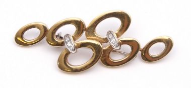 18ct gold and diamond stylised brooch, the design of two rows of graduated ovals joined by two