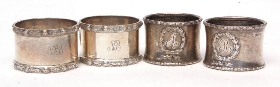 Mixed Lot: two various pairs of cylindrical napkin rings, all initialled, combined wt approx 115gms,