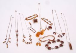 Mixed Lot: quantity of modern white metal and amber set jewellery to include bracelets, pendants,