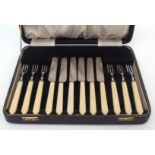 Mid-20th century cased set of six each dessert knives and forks with composite handles and