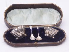 Cased pair of Victorian open salts of crimped flower circular form and each raised on three ball