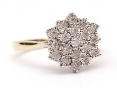 Modern 9ct gold diamond cluster ring, of flowerhead design, set with 19 small diamonds, 0.20ct