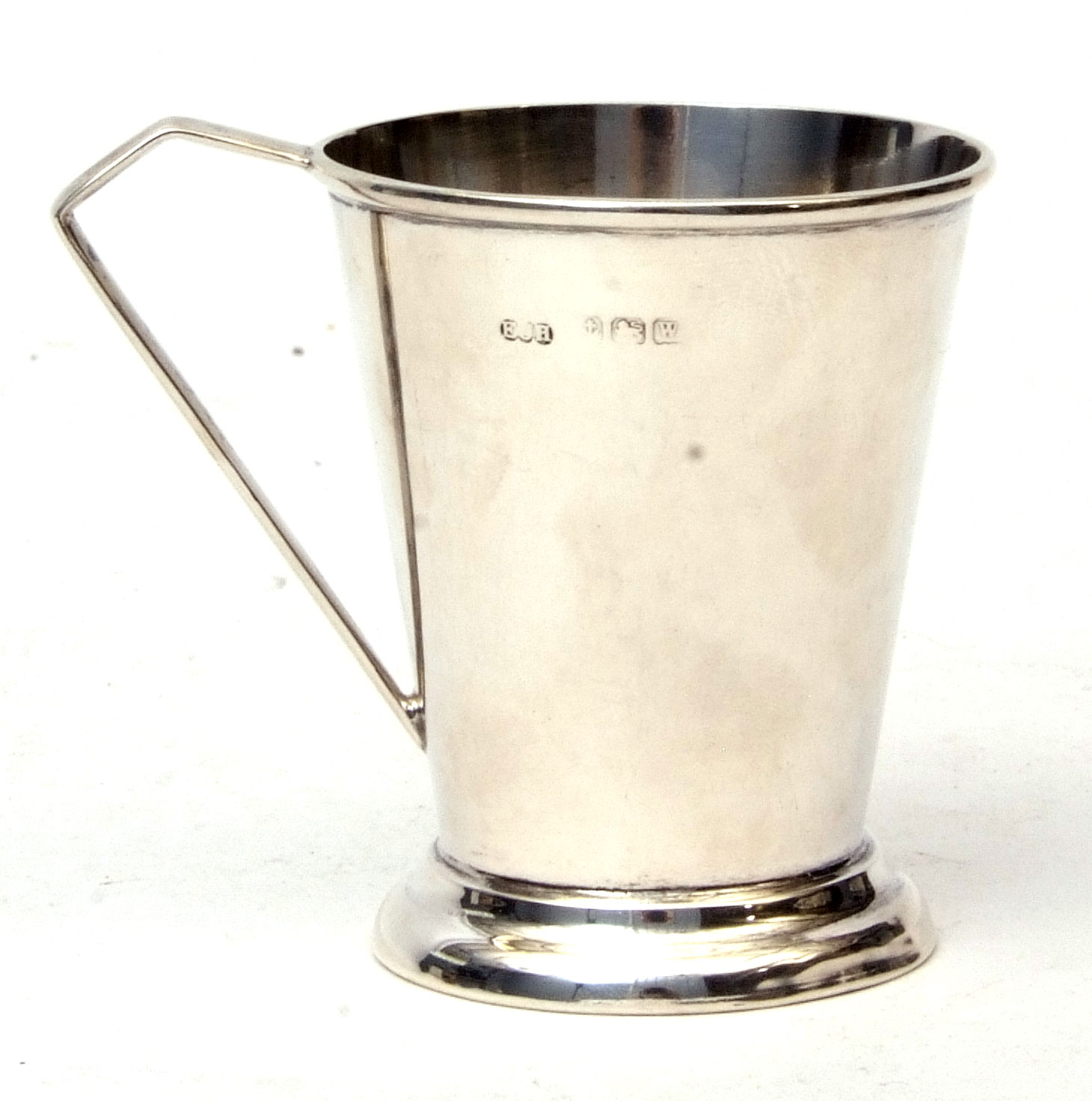 George VI christening mug of plain polished tapering cylindrical form with strapwork handle on