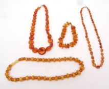 Mixed Lot: four modern Bakelite amber coloured bead necklaces (4)
