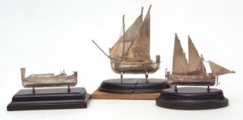 Mixed Lot: three various white metal models of marine vessels including two sailing boats and a