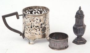 Mixed Lot: silver glass holder together with single napkin ring and single pepper caster, combined