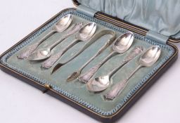 Cased set of six Edward VII coffee spoons together with matching sugar tongs in a silk and velvet